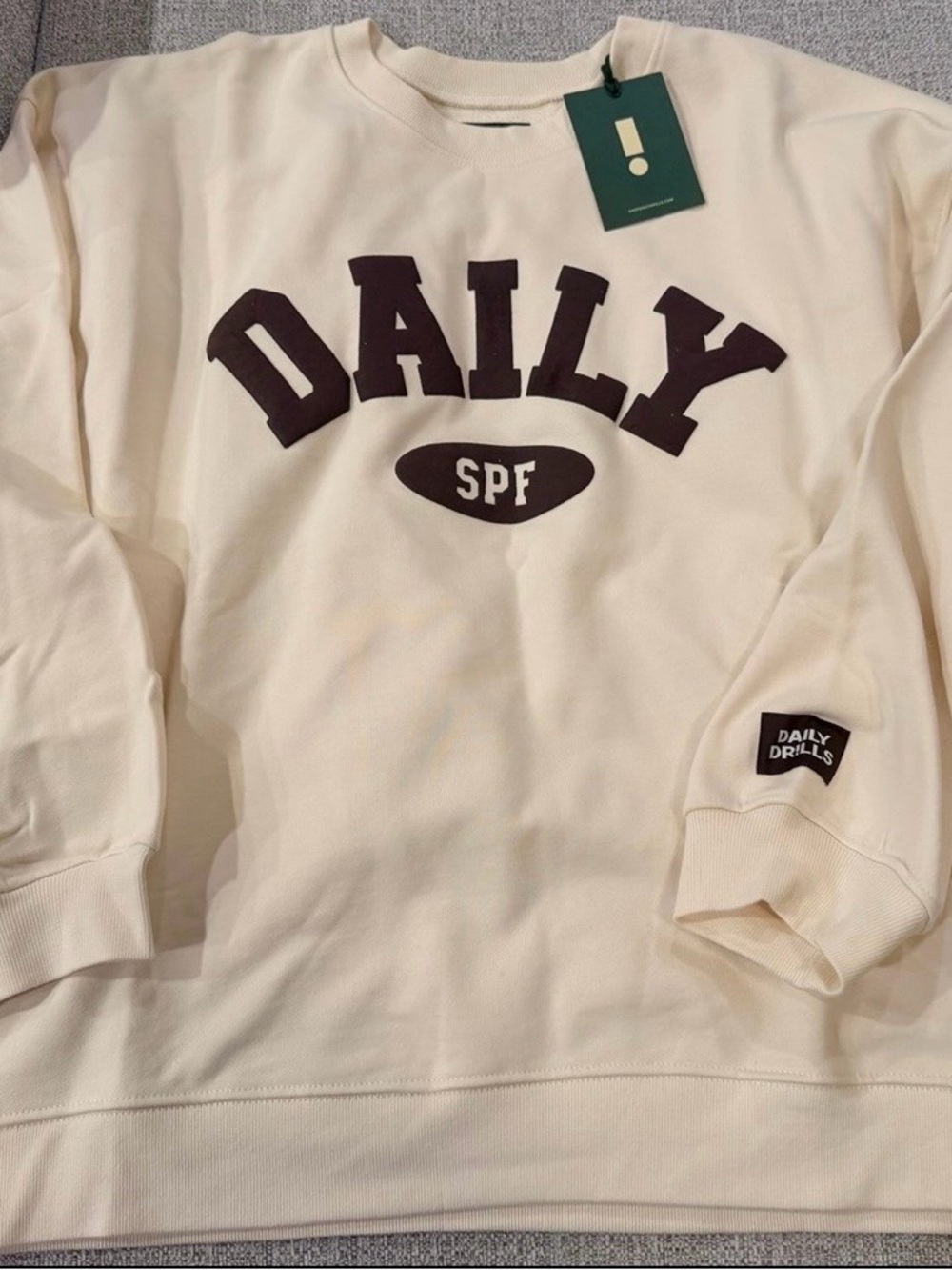 Daily Drills Cream Crewneck with Dark Brown 'DAILY' Logo